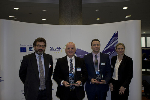 NATS' Tony Vaudrey and Kevin Loy with Alex Brooker, Snowflake Software and Lisa Sullivan of Harris, collecting their awards at the SESAR SWIM Master Class 2013.