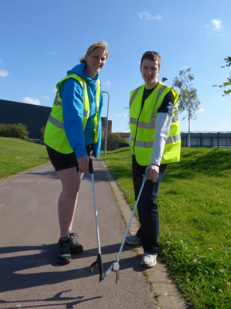 Vicky Newhouse, Engineering Manager for the Early Careers Scheme at NATS, and Placement System Engineer Jonathan Marmont picking litter in Whiteley